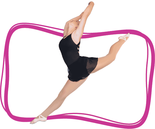 A young girl in dance jumps into the air with one leg in the air behind her and both arms above her head.